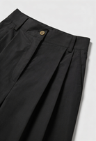 Victoria Lumina high-waisted black palazzo pants for women, tailored wide-leg trousers with a chic, flowing silhouette.