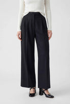 Victoria Lumina women's high-waisted black trousers with a tailored fit and comfortable design, shown on a model.