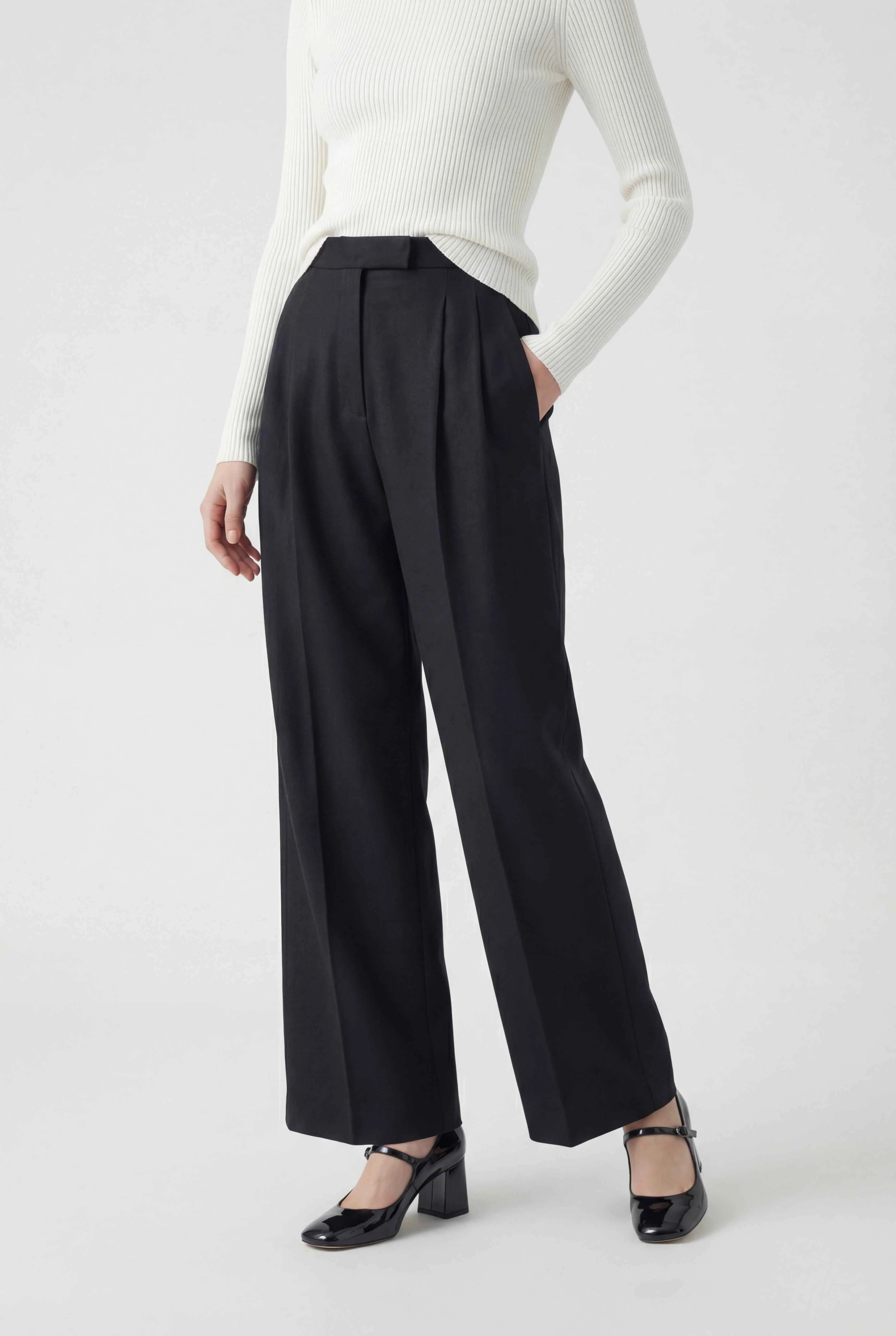 Victoria Lumina black high-waisted tailored women's trousers with a comfortable fit, shown on a model.