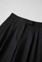 Victoria Lumina high-waisted black women's trousers with tailored fit and comfortable fabric, shown on a model.