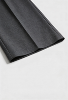 Victoria Lumina gray high-waisted tailored trousers with elegant draping, showcasing a sleek fit and sophisticated style.