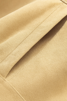 Victoria women's khaki jacket with O-neck design by Lumina Wear, featuring a classic, timeless style and comfortable fit.