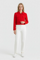 Red Lumina Wear Victoria women's cropped button jacket with flattering fit, shown on a model. Stylish outerwear for trendy looks.