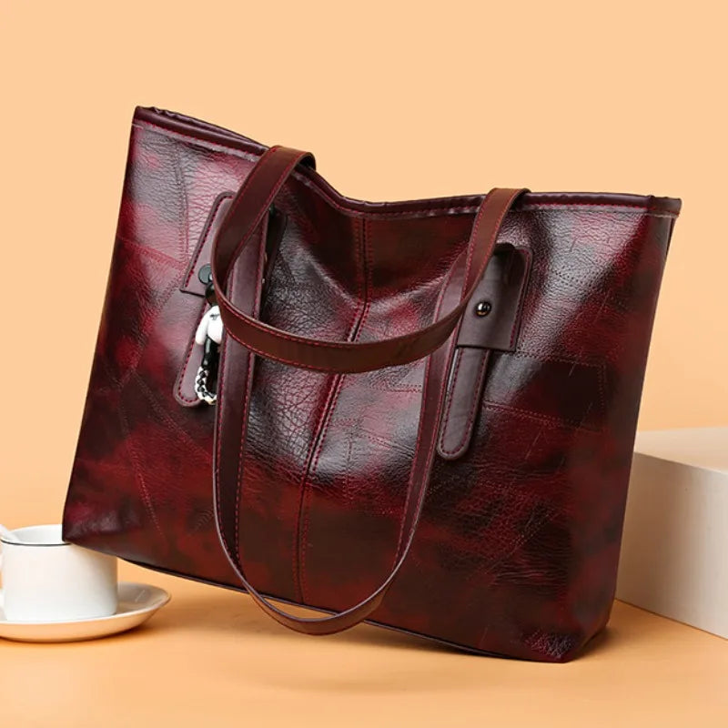 Lumina Wear Victoria vintage-inspired spacious tote bag in khaki with keychain accent and sturdy handles.