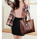 Lumina Wear Victoria vintage-inspired spacious tote bag in khaki with keychain accent, stylish handbag with ample storage.