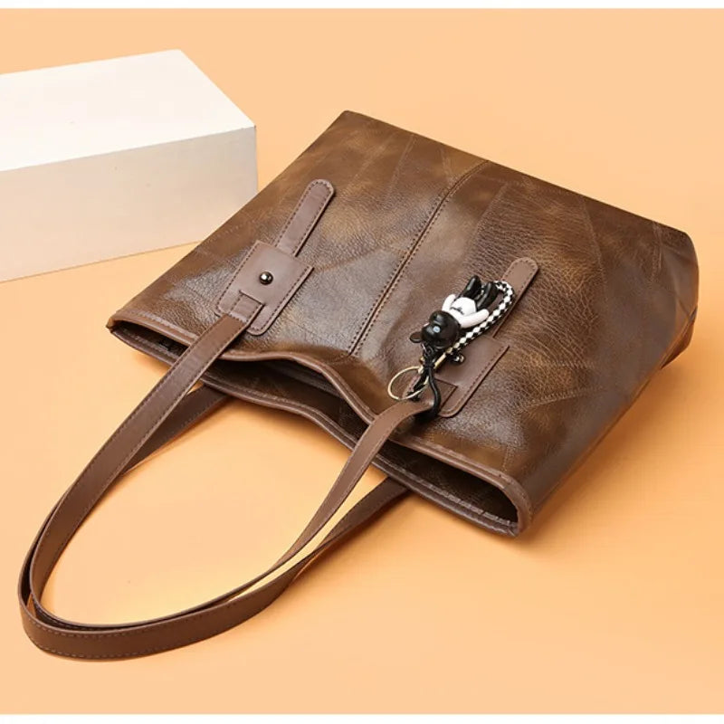 Lumina Wear Victoria vintage-inspired spacious tote bag in khaki with keychain accent, stylish handbag with ample room.