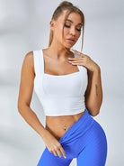White Lumina Vancouver sports bra with wide shoulder straps, designed for support and comfort during athletic activities.