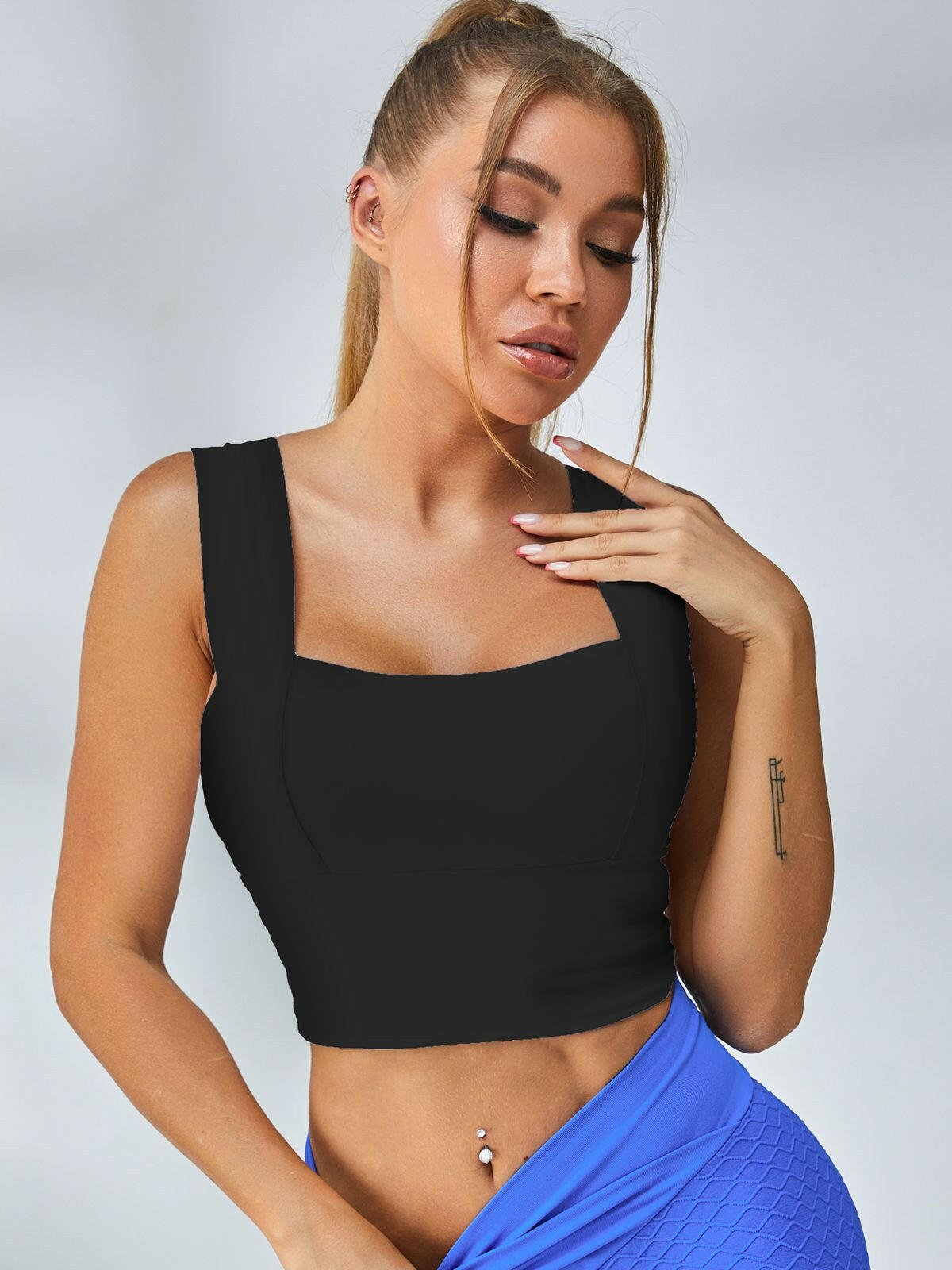 White Lumina Vancouver sports bra with wide shoulder straps, designed for comfort and support during workouts.