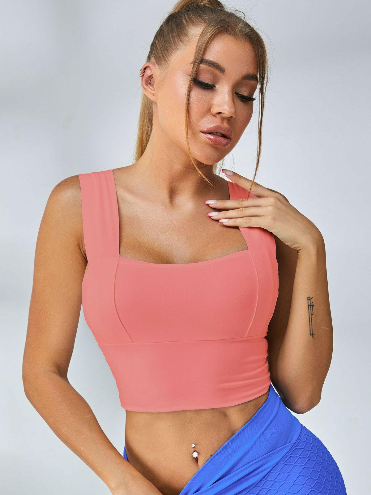 White Lumina Vancouver wide shoulder strap sports bra with supportive design and breathable fabric for active wear.