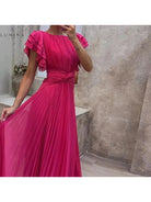 Willow colorful pink evening dress by Lumina Vancouver, perfect for wedding guests, shown on a model.