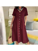 White Yasmin buttoned dress by Lumina Wear, showcasing a stylish, effortless design perfect for casual or semi-formal wear.