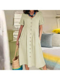 White Yasmin buttoned dress by Lumina Wear, casual and elegant, shown on a model with a relaxed fit and stylish design.
