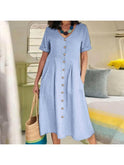 White Yasmin Effortless Buttoned Dress by Lumina Wear, stylish and casual, shown on a model with a relaxed fit and button details.