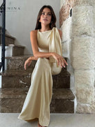 Off-white Yasmine knotted maxi dress by Lumina Vancouver, flowing fabric and elegant design for stylish summer wear.