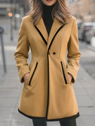 Lumina Wear Briony double-breasted white coat with trim, stylish women's winter coat on a hanger.